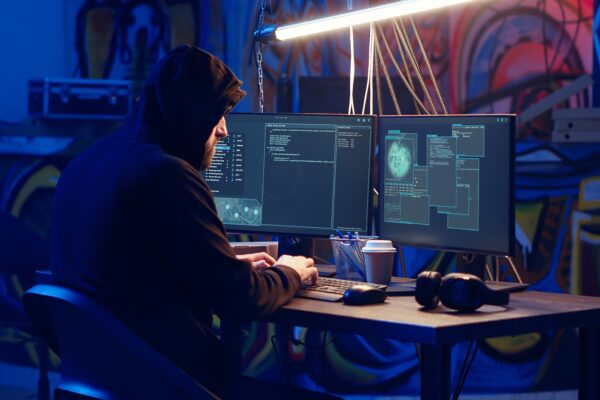 Hacker uses PC to target vulnerable unpatched connections, seeking to compromise digital devices and steal valuable sensitive data. Rogue programmer finds exploits for system vulnerabilities, camera B