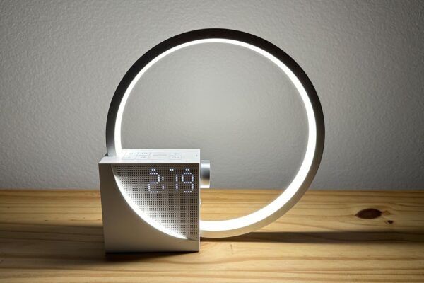 Vivilumens Sunrise Alarm Clock a silver ring with a square base attached to the lower left corner