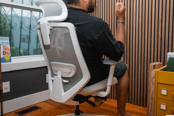 Image may contain: Indoors, Interior Design, Chair, Furniture, Adult, Person, Wood, and Hardwood