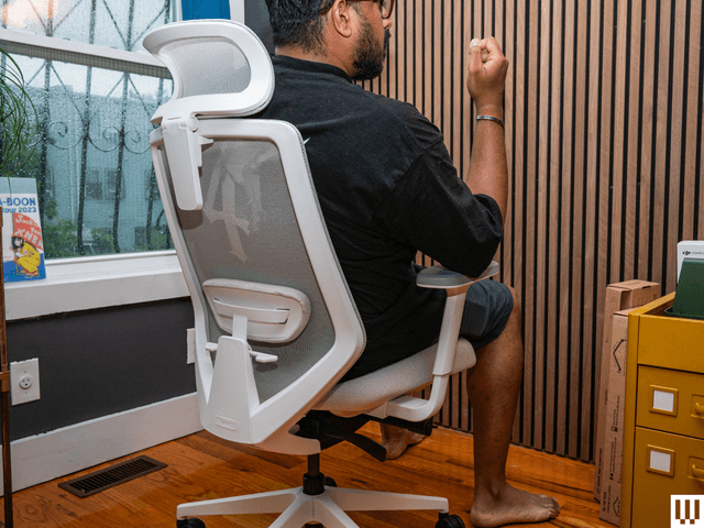 Image may contain: Indoors, Interior Design, Chair, Furniture, Adult, Person, Wood, and Hardwood