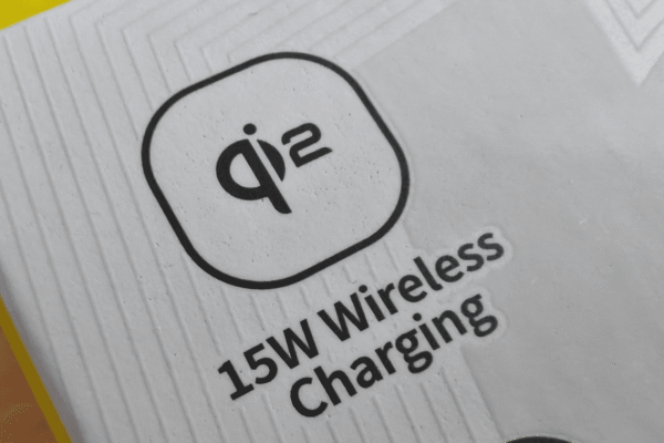 Close up of white packaging showing a logo for Qi2 wireless charging
